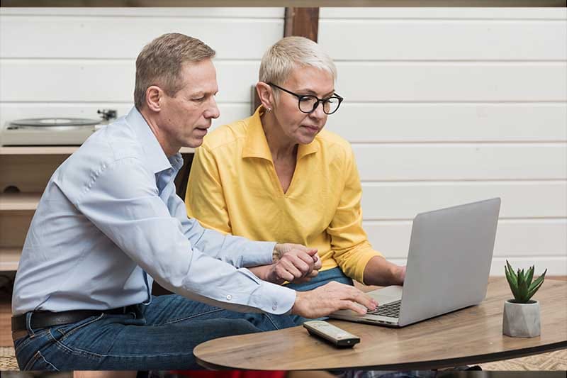 flemington business owners checking laptop